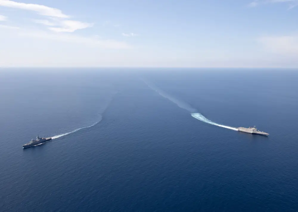 The Independence-variant littoral combat ship USS Gabrielle Giffords (LCS 10), right, exercises with the Republic of Singapore Navy Formidable-class multi-role stealth frigate RSS Steadfast (FFS 70) in the South China Sea, May 25, 2020.