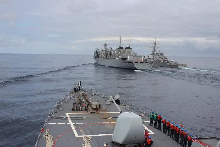The guided-missile destroyer USS Donald Cook (DDG 75) approaches the fast combat support ship USNS Supply (T-AOE 6) and USS Porter (DDG 78) while operating with the Royal Navy Type 23 frigate HMS Kent (F 78), not pictured, above the Arctic Circle during a bilateral anti-submarine exercise in the North Sea. (U.S. Navy photo Yeoman 3rd Class Anthony Nichols/Released)