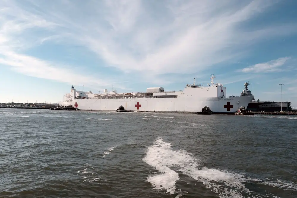 The hospital ship USNS Comfort (T-AH 20) returns to its homeport of Naval Station Norfolk after treating patients in New York and New Jersey in support of the COVID-19 pandemic. The ship and its embarked medical task force remain prepared for future tasking. The Navy, along with other U.S. Northern Command dedicated forces, remains engaged throughout the nation in support of the broader COVID-19 response. (U.S. Navy photo by Mass Communication Specialist 1st Class Joshua D. Sheppard/Released)