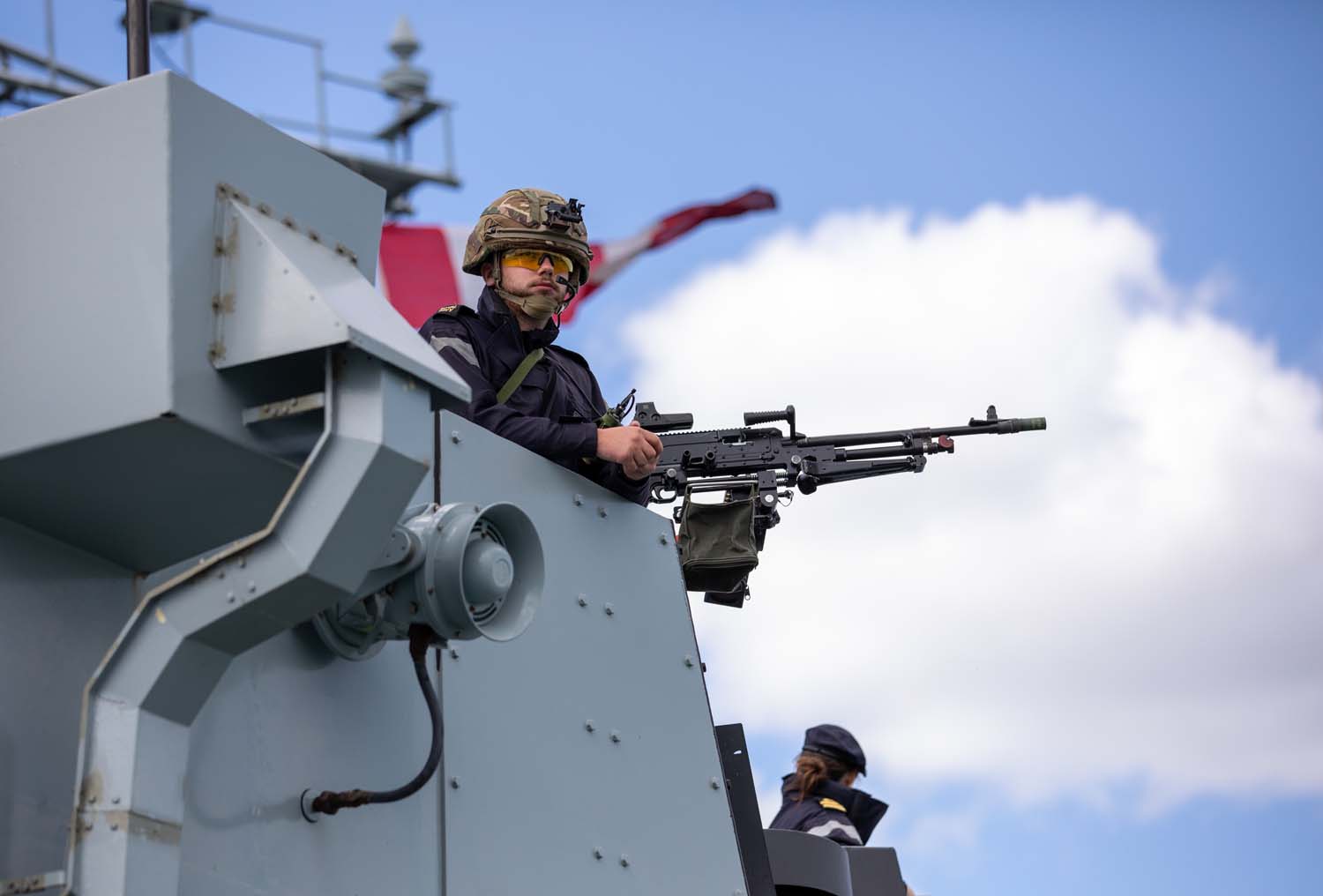 Gunner on bridge wing of HMS Lancaster