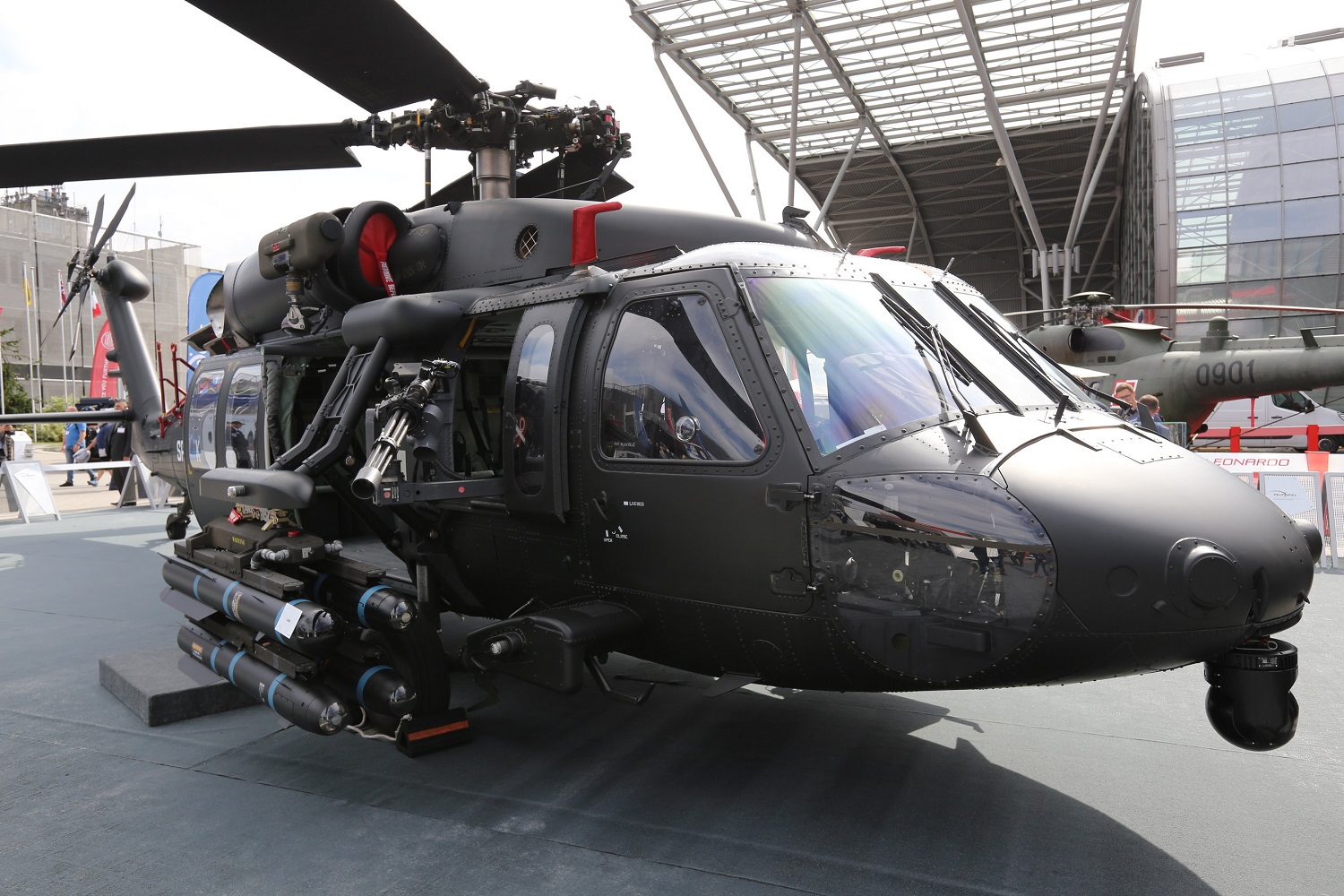An S-70i Black Hawk helicopter at the MSPO trade show carries a lightweight single-station external stores pylon supporting four Hellfire air-to-ground missiles. 