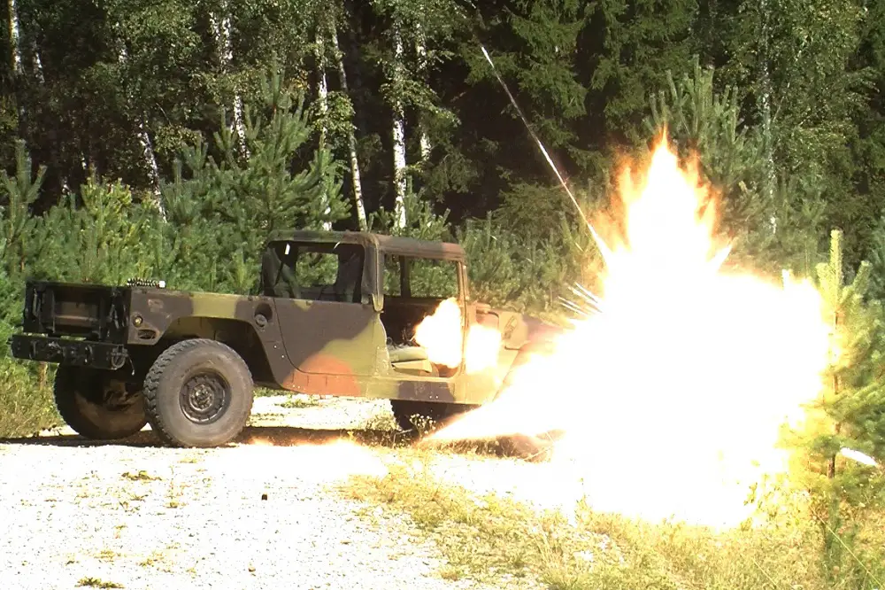 A Selectable Lightweight Attack Munition (SLAM) explodes on a target during the live fire portion of a SLAM class at the 7th Army Training Command's Grafenwoehr Training Area, Germany