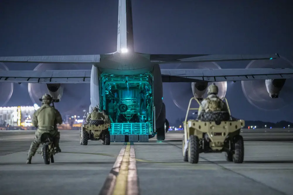 U.S. Air Force Special Tactics operators with the 320th Special Tactics Squadron out of Kadena Air Base, Japan, wait to load their vehicles into a C-130J Super Hercules during an engine running onload/offload (ERO) training as part of Exercise Gryphon Jet at Yokota Air Base, Japan, June 23, 2020.