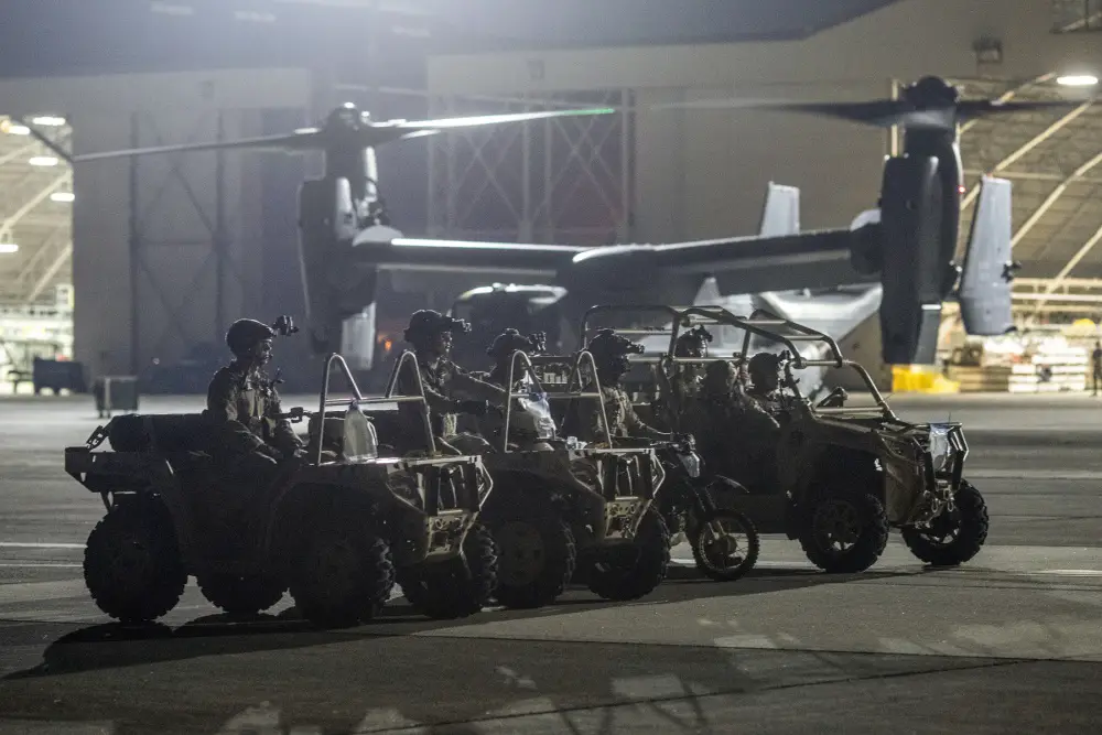Air Force Special Tactics operators with the 320th Special Tactics Squadron out of Kadena Air Base, Japan, wait to load their tactical vehicles into a C-130J Super Hercules during an engine running onload/offload (ERO) training as part of Exercise Gryphon Jet at Yokota Air Base, Japan, June 23, 2020. 
