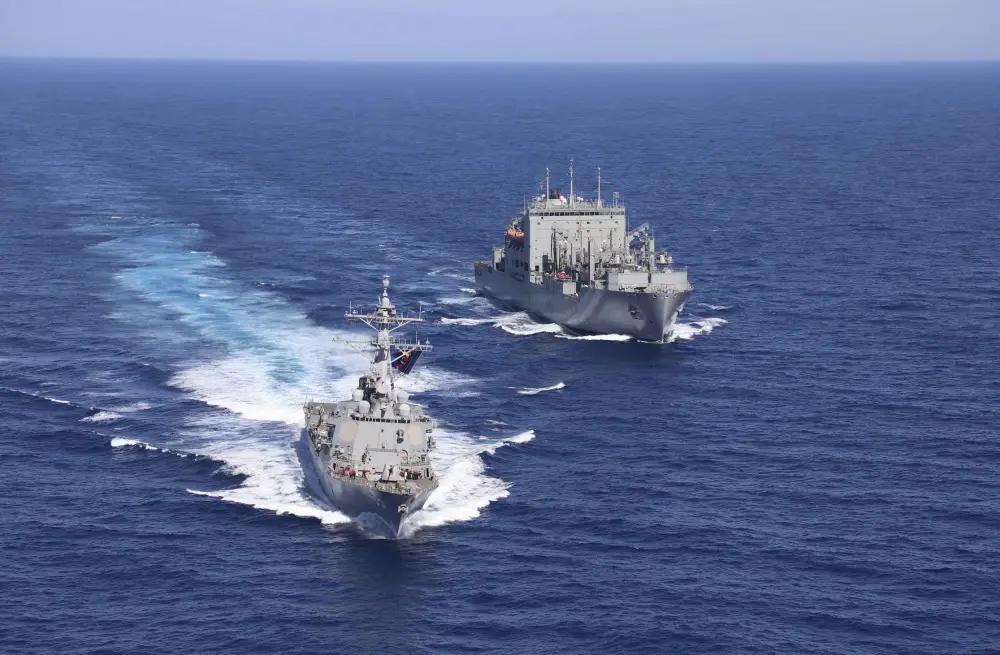 he Arleigh Burke-class guided-missile destroyer USS McCampbell (DDG 85) sails alongside the Lewis and Clark-class dry cargo ship USNS Carl Brashear (T-AKE 7) after a replenishment-at-sea (RAS). 