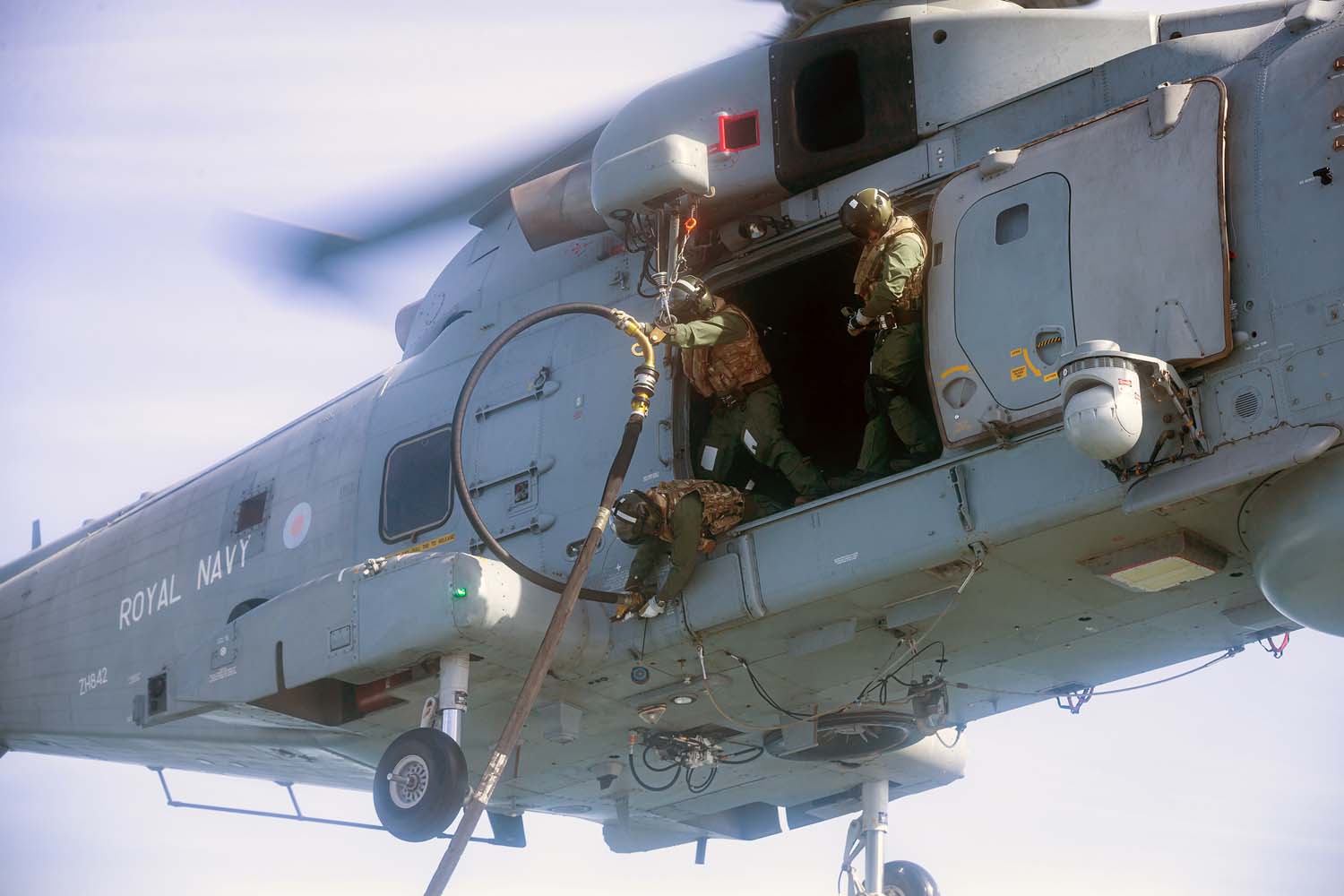 Royal Navy Merlin Helicopter Refuels in Flight from HMS Westminster