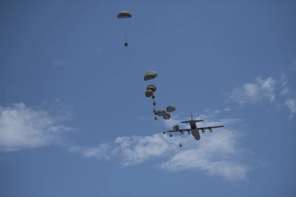 Containerized Delivery System Bundles are dropped from a C-130J Super Hercules aircraft during a Joint Forcible Entry exercise at Dyess Air Force Base, Texas, July 14, 2020. The exercise helped showcase the maintained readiness of the C-130J community despite the ongoing COVID-19 pandemic. 