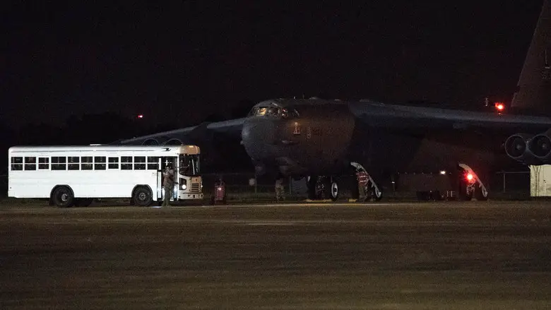 Barksdale aircrew exit a bus before taking off in a B-52H Stratofortress from Barksdale Air Force Base, La., in support of a U.S. Strategic Command Bomber Task Force, July 2, 2020. BTF missions familiarize aircrews with air bases, procedures and operations in different Geographic Combatant Command's areas of operations. (U.S. Air Force photo by Senior Airman Tessa B. Corrick)