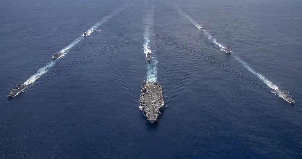 The Nimitz Carrier Strike Group, consisting of flagship USS Nimitz (CVN 68), Ticonderoga-class guided missile cruiser USS Princeton (CG 59), and Arleigh Burke-class guided missile destroyers USS Sterett (DDG 104) and USS Ralph Johnson (DDG 114), along with Indian Navy ships Rana, Sahyadri, Shivalik and Kamorta, steam in formation during a cooperative deployment in the Indian Ocean July 20.