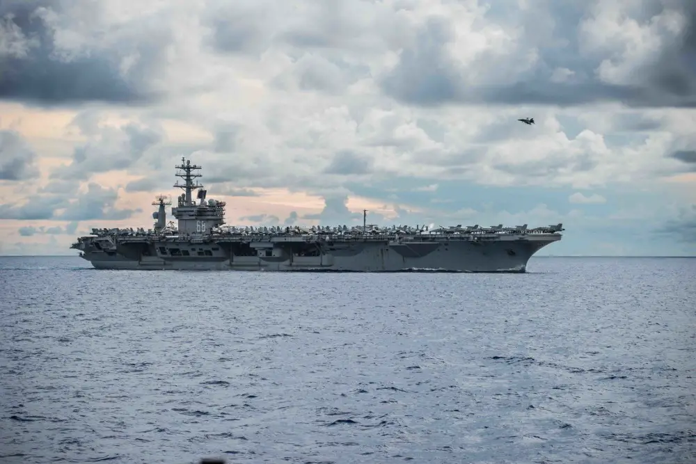 USS Nimitz (CVN 68) steams alongside the Navy's only forward-deployed aircraft carrier USS Ronald Reagan (CVN 76). Nimitz and Ronald Reagan Carrier Strike Groups are conducting dual-carrier as the Nimitz Carrier Strike Force.