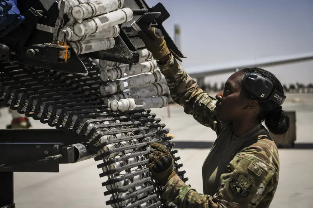 U.S. Air Force Staff Sgt. Sharane Watson reloads the General Electric GAU/8 Avenger 30mm hydraulically driven seven-barrel autocannon of an A-10 Thunderbolt II at Kandahar Airfield, Afghanistan.