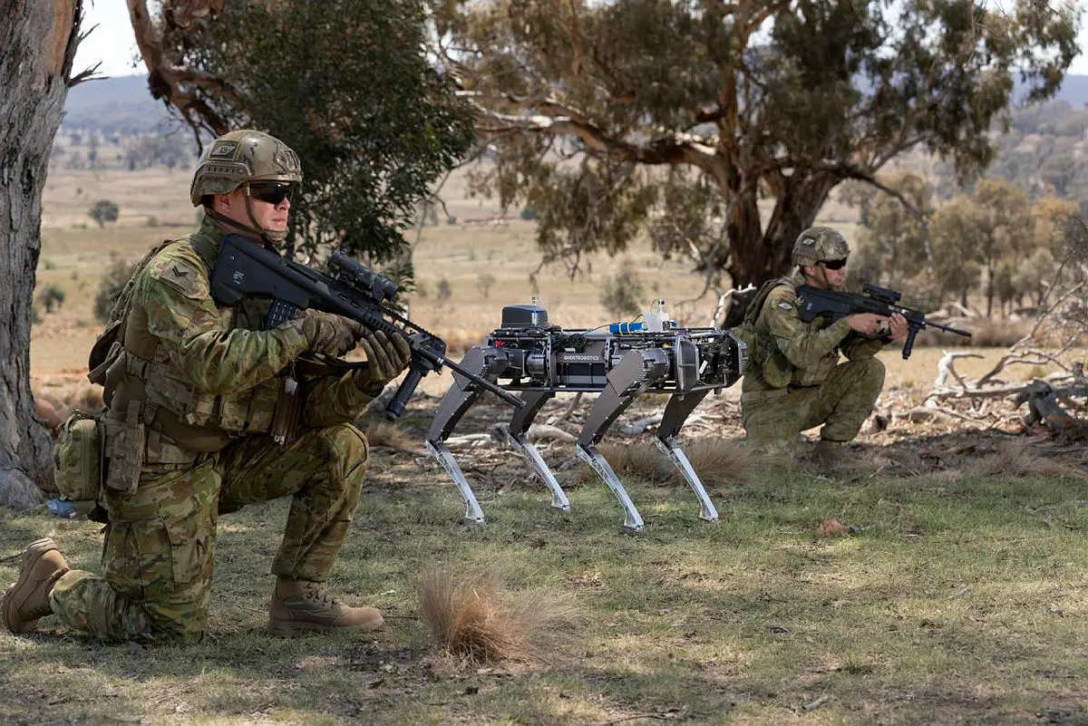 A Ghost Robotics unmanned ground vehicle supports Australian Army soldiers conduct an enemy position clearance during an autonomous systems showcase at the Majura Training Area, Canberra.