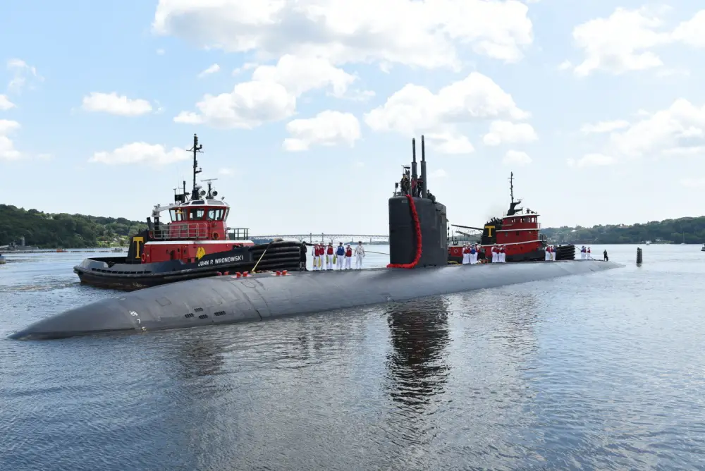 Sailors assigned to the Los Angeles-class fast-attack submarine USS Hartford (SSN 768), stand topside as they pull into their homeport at Naval Submarine Base New London in Groton, Conn. July 24, 2019. Hartford executed the chief of naval operation's maritime strategy in supporting national security interests and maritime security operations.