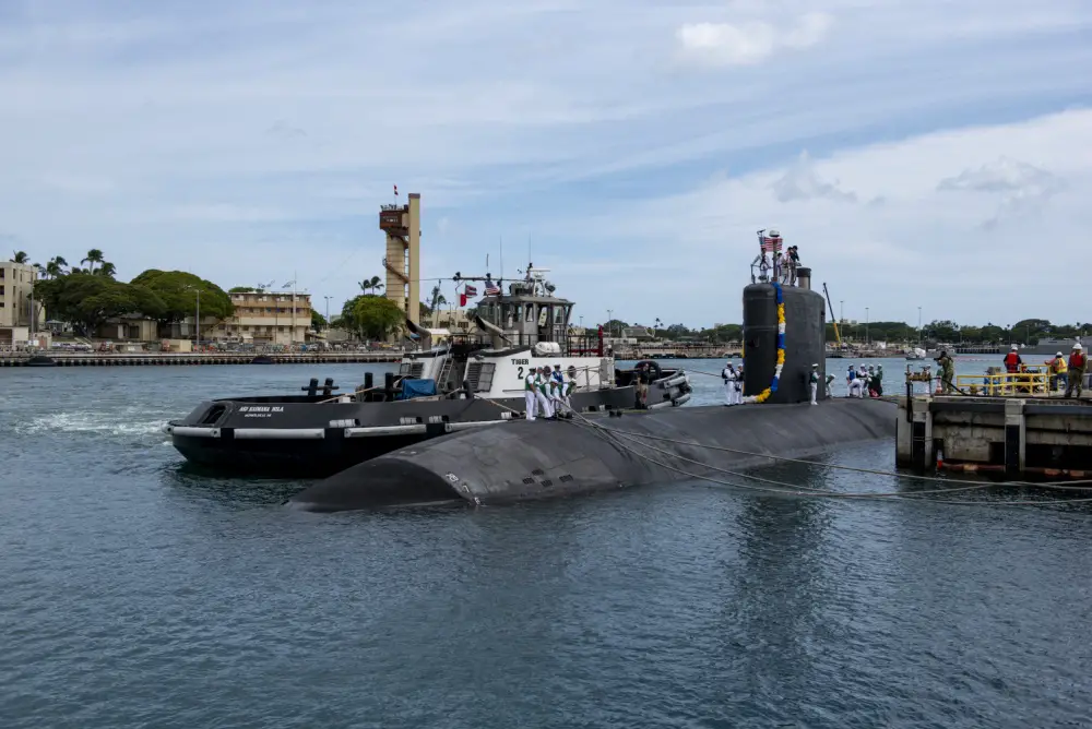  Sailors aboard the Los Angeles-class fast-attack submarine USS Columbia (SSN 771) prepare to moor at the historic submarine piers at Joint Base Pearl Harbor-Hickam following a six-month Western Pacific deployment, June 6. 