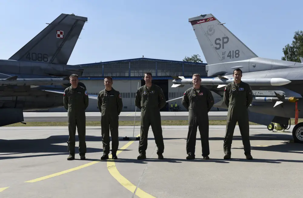 Starting far left, Polish air force Col. Tomasz Jatczak, 32nd Tactical Air Base commander, Brig. Gen. Iteneusz Nowak, 2nd Tactical Air Wing commander, U.S. Air Force Col. David Epperson, 52nd Fighter Wing commander, Lt. Col. Patrick Kennedy, 480th Expeditionary Fighter Squadron commander, and Lt. Col. Albert Roper, 52nd Operations Group Detachment One commander, stand in front of a static display for brief interviews at Åask AB, Poland, August 21, 2020.