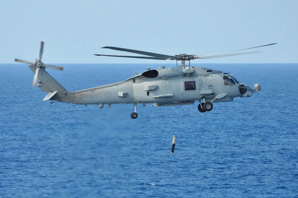 The Royal Australian Navy's MH-60R Romeo helicopter conducts functional testing of the newly fitted Airborne Low Frequency Sonar System (ALFS) off the coast of Jacksonville, Florida.