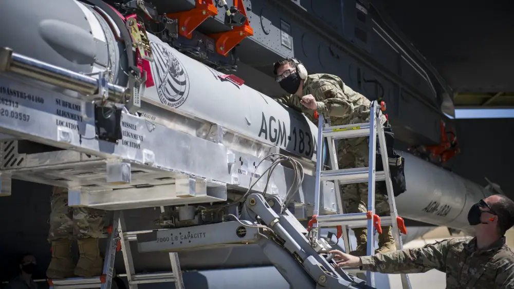 Staff Sgt. Jacob Puente, 912th Aircraft Maintenance Squadron, helps line up the AGM-183A Air-launched Rapid Response Weapon Instrumented Measurement Vehicle 2 as it is loaded under the wing of a B-52H Stratofortress at Edwards Air Force Base, California, Aug. 6.