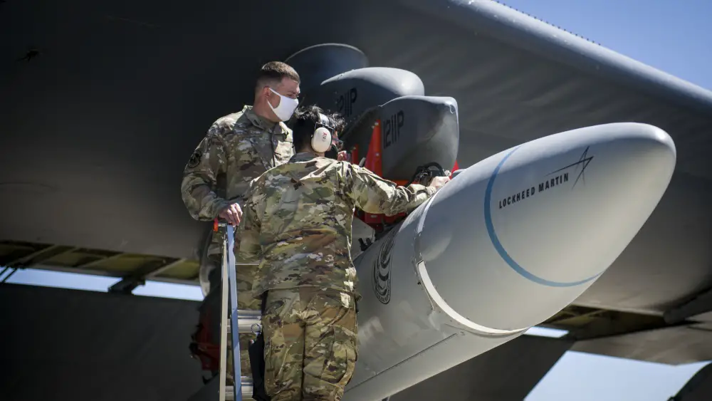 Master Sgt. John Malloy and Staff Sgt. Jacob Puente, both from 912th Aircraft Maintenance Squadron, secure the AGM-183A Air-launched Rapid Response Weapon Instrumented Measurement Vehicle 2 as it is loaded under the wing of a B-52H Stratofortress at Edwards Air Force Base, California, Aug. 6. 