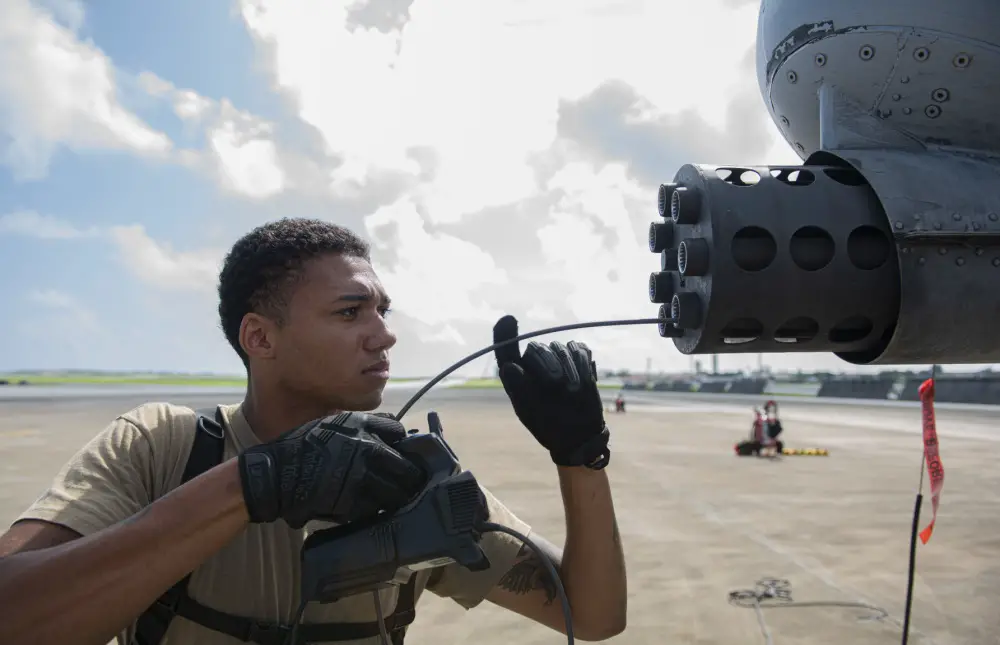 U.S. Air Force Senior Airman Anthony Knight, inserts a camera into the front of GAU-8 Avenger 30mm cannon on an A-10 Thunderbolt II to inspect for corrosion at Andersen Air Force Base, Guam, Aug. 17, 2020
