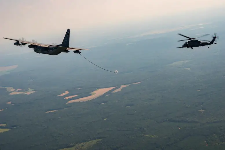 An HH-60W Jolly Green II prepares to connect with an HC-130J tanker for its first aerial refueling over southern Alabama, Aug. 5, 2020. The Air Force's newest combat search and rescue helicopter is currently undergoing developmental and operational testing.