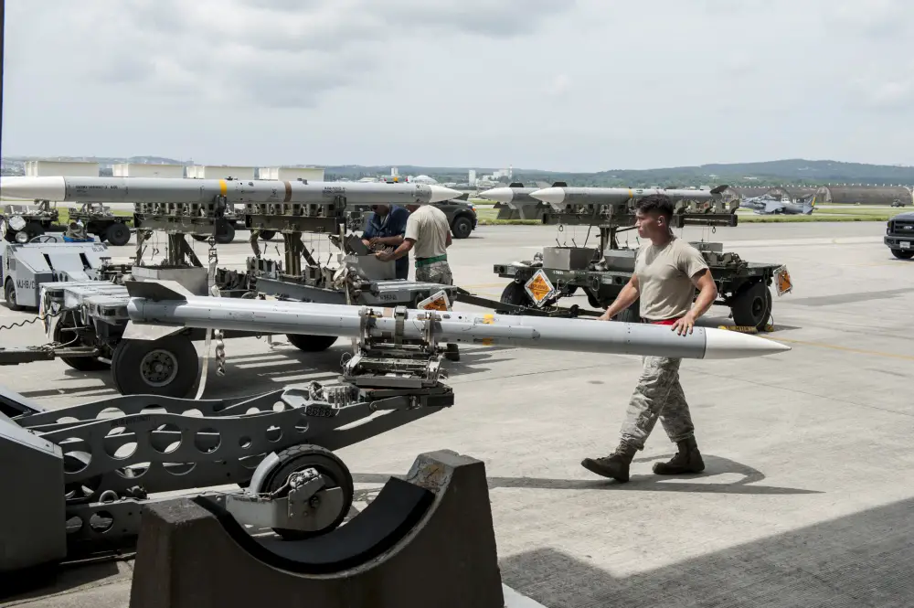 Maintainers loaded AIM-9 sidewinder missiles, AIM-120 advanced medium-range air-to-air missiles, flares, and M-61A1 cannon rounds onto F-15 Eagles, before the aircraft taxied and were dispersed around the flight line.