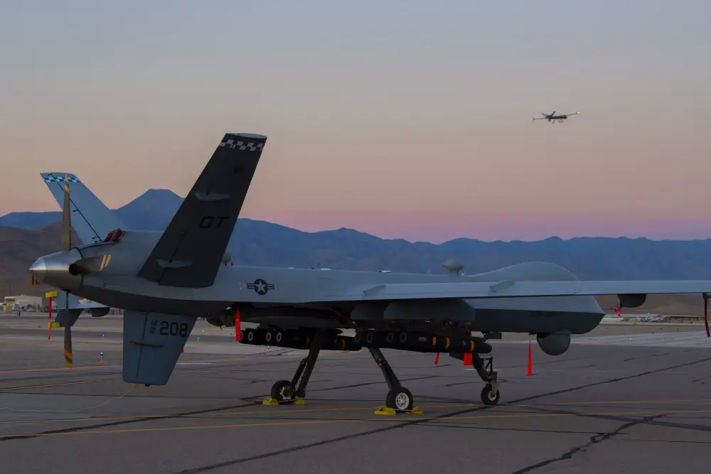 An MQ-9A Reaper assigned to the 556th Test and Evaluation Squadron sits on the ramp at Creech Air Force Base carrying eight Hellfire missiles. This was the first flight test of the MQ-9 carrying eight Hellfire missiles. (U.S. Air Force photo by SrA Haley Stevens).