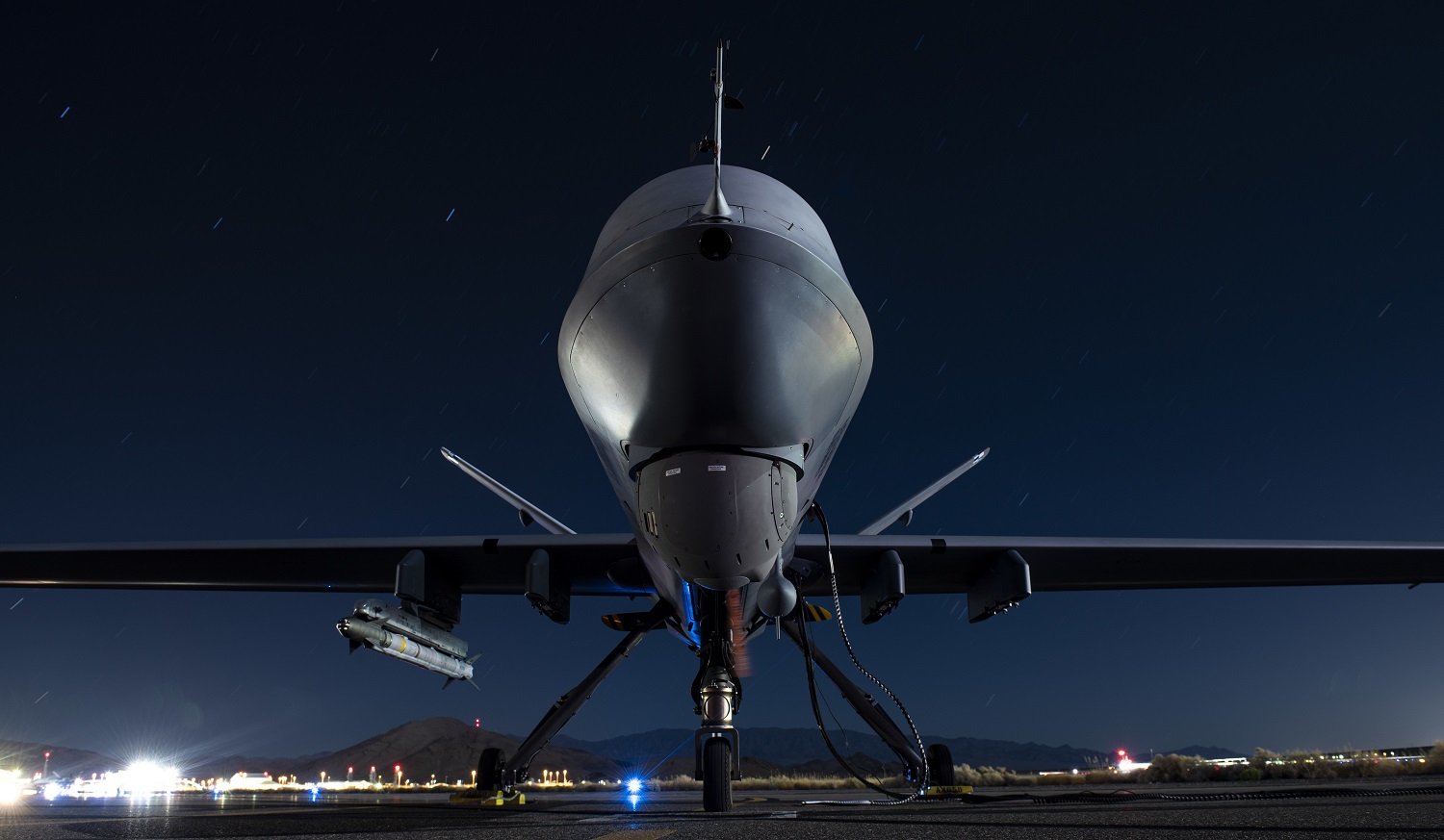 A U.S. Air Force MQ-9 Reaper assigned to the 556th Test and Evaluation Squadron armed with an AIM-9X missile sits on the ramp on September 3, 2020 ahead of the ABMS Onramp #2.