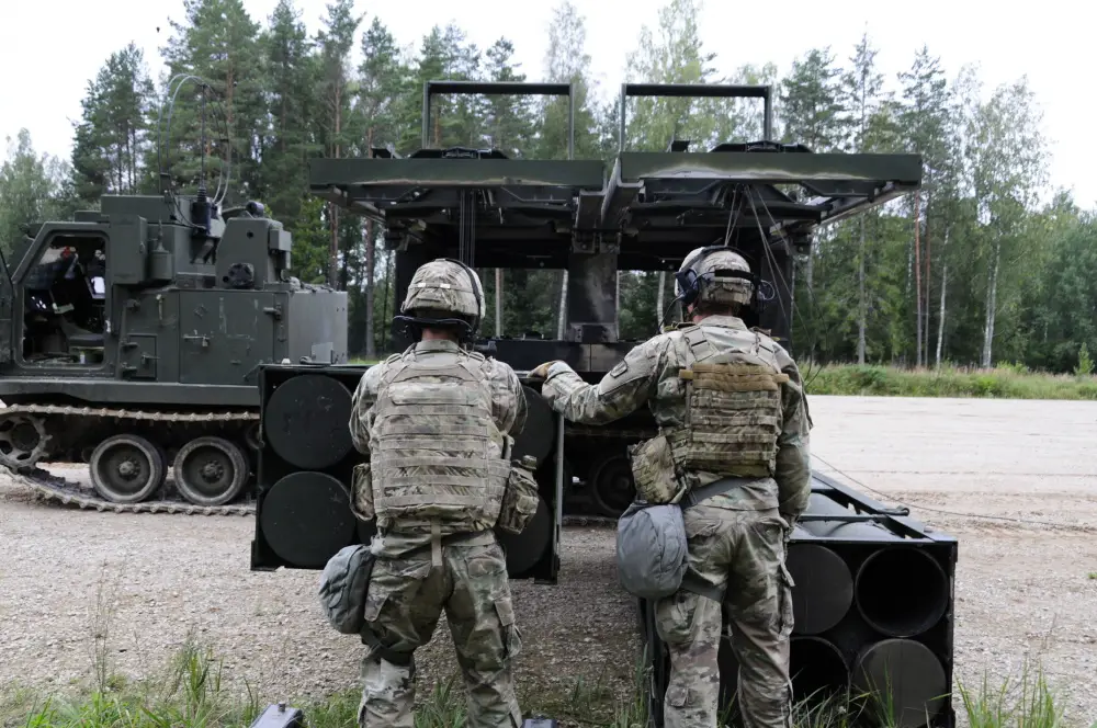 Soldiers assigned to Bravo Battery, 1st Battalion, 6th Field Artillery Regiment load training rounds into their Multiple Launch Rockets Systems during a NATO allied live fire Exercise in Tapa, Estonia Sept. 5, 2020.