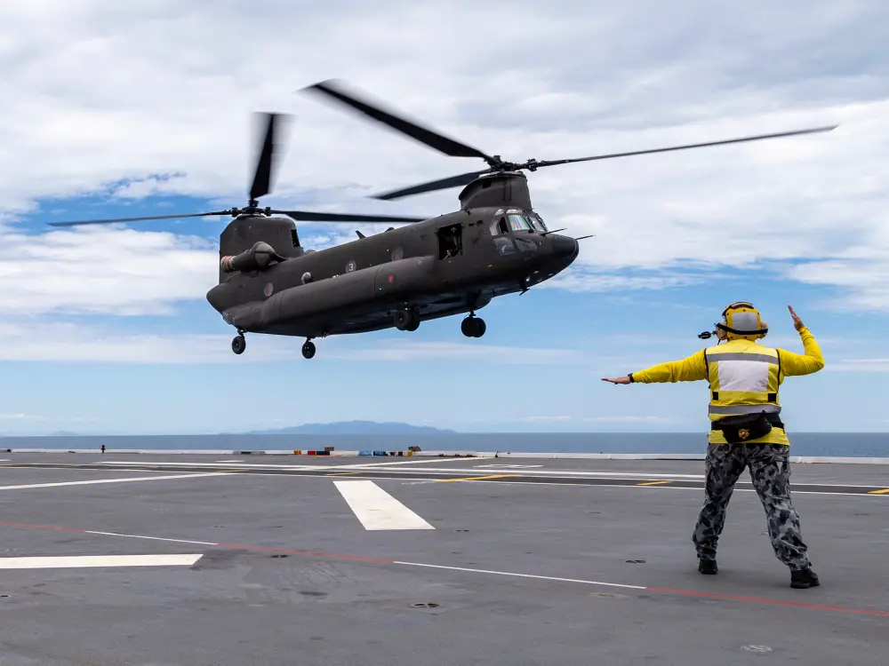 A Republic of Singapore Air Force CH-47 Chinook helicopter lands onboard HMAS Adelaide during Exercise SEA WADER 2020, off the coast of Townsville, Queensland.