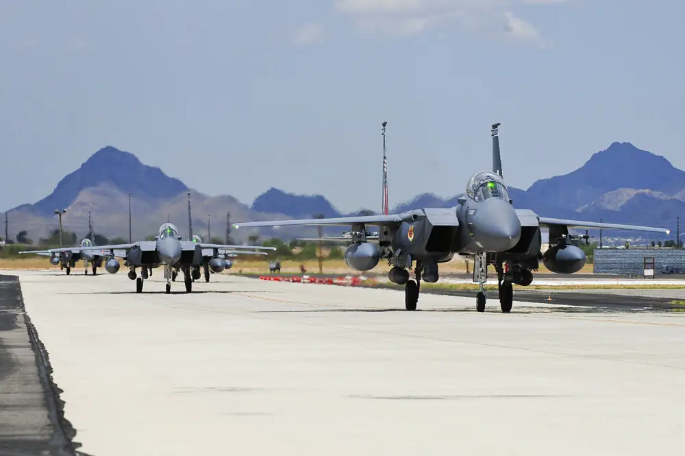 F-15SG fighter jets from the 428th Fighter Squadron at Mountain Home Air Force Base, Idaho, taxi from the runway at Davis-Monthan Air Force Base, Ariz., July 7, 2015. Ten of the fighter jets arrived to train at D-M until Aug. 24 while MHAFB's runway is closed for maintenance. (U.S. Air Force photo by Airman 1st Class Chris Drzazgowski/Released)