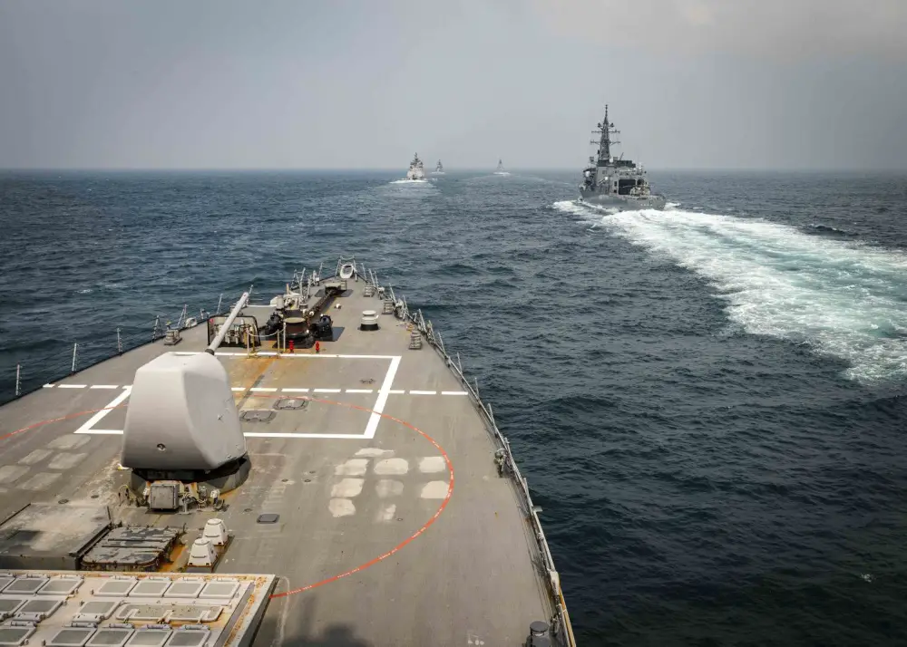The Arleigh Burke-class guided-missile destroyer USS John S. McCain (DDG 56) sails in formation with ships from the Indian Navy, Royal Australian Navy, and Japan Maritime Self-Defense Force while conducting replenishment-at-sea approaches (RASAPs) as part of Malabar 2020. (U.S. Navy photo by Mass Communication Specialist 2nd Class Markus Castaneda/Released)