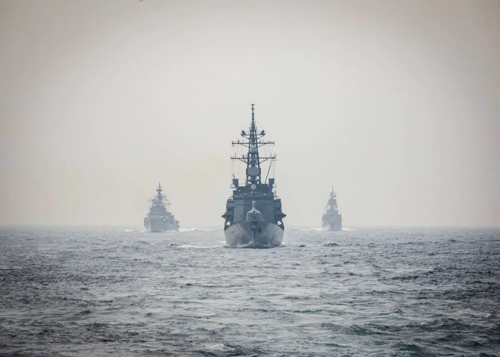 Ships from the Indian Navy, Royal Australian Navy, and Japan Maritime Self-Defense Force make their approach toward the Arleigh Burke-class guided-missile destroyer USS John S. McCain (DDG 56) while conducting replenishment-at-sea approaches (RASAPs) as part of Malabar 2020.