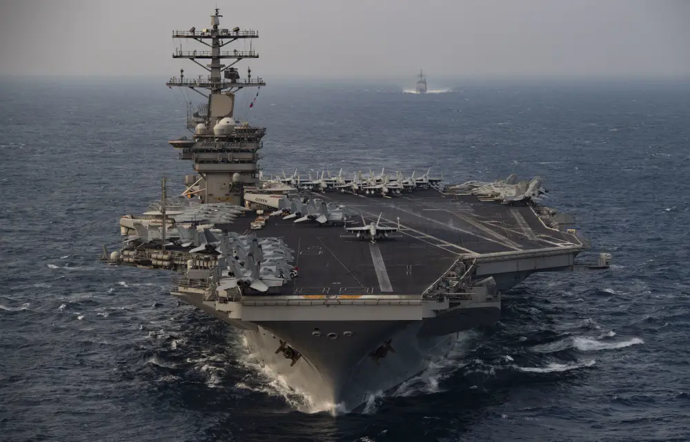 The aircraft carrier USS Nimitz (CVN 68) steams ahead of the guided-missile cruiser USS Princeton (CG 59) while participating in Malabar 2020 in the North Arabian Sea.