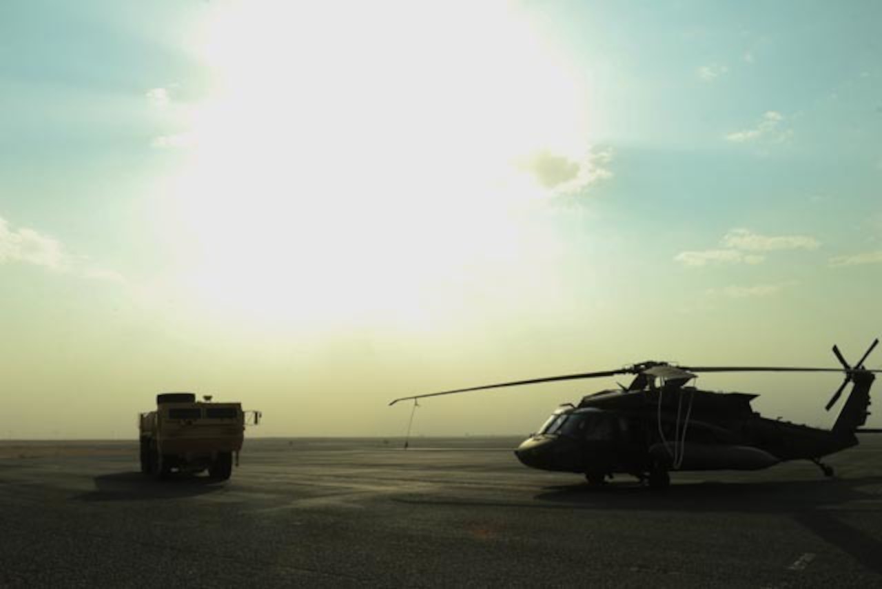 U.S. soldiers with the 28th Expeditionary Combat Aviation Brigade conduct an emergency exercise with the Udairi Landing Zone emergency medical technician team at an airfield in Kuwait, Dec. 16, 2020.