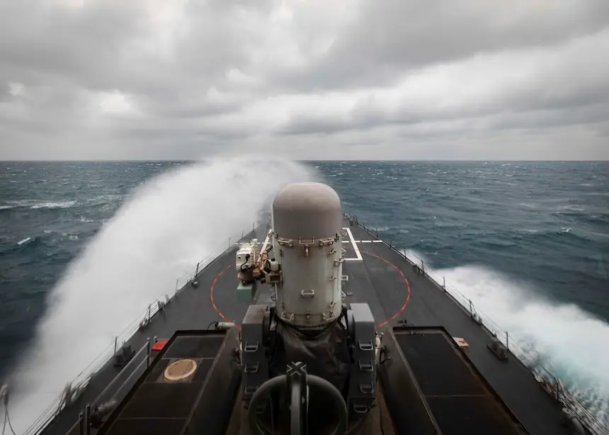 Cmdr. Ryan T. Easterday, commanding officer of the guided-missile destroyer USS John S. McCain (DDG 56) scans the horizon from the bridge wing as the ship conducts routine underway operations in support of stability and security for a free and open Indo-Pacific.