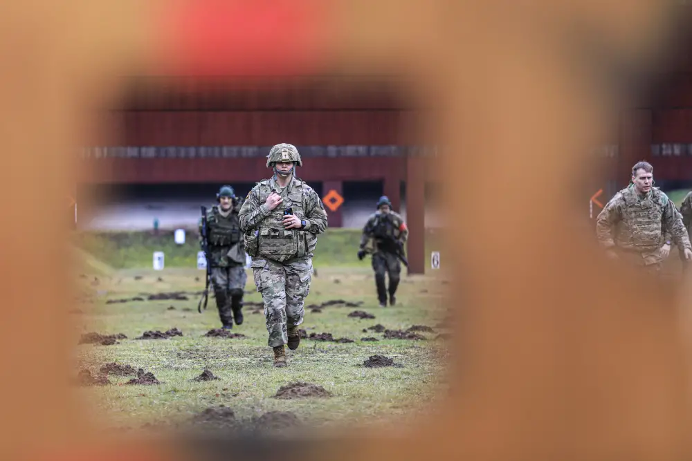 U.S. Soldiers return from the firing line after engaging targets during the German Armed Forces Badge of Marksmanship, or SchÃ¼tzenschnur, at Breitenwald Range, Feb. 5. U.S. Soldiers joined German Armed Forces (Bundeswehr) Service Members for a chance to earn the badge.