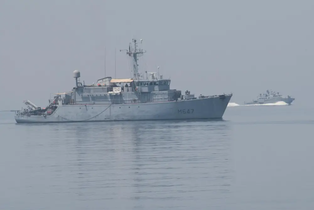 The French Marine Nationale minehunter FS L'Aigle (M 647), left, conducts force protection training with a Mark VI patrol boat, attached to Commander, Task Force (CTF) 56, during exercise Artemis Trident 21 in the Arabian Gulf, April 21.