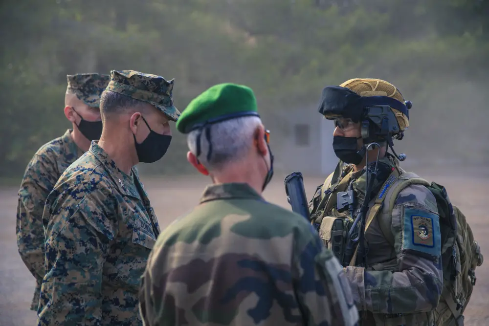 U.S. Marine Corps Maj. Gen. Francis Donovan, commanding general, 2d Marine Division, interacts with a French infantryman with 21st Marine Infantry Regiment, 6th Light Armoured Brigade, after a dynamic display in FrÃ©jus, France, June 1, 2021.