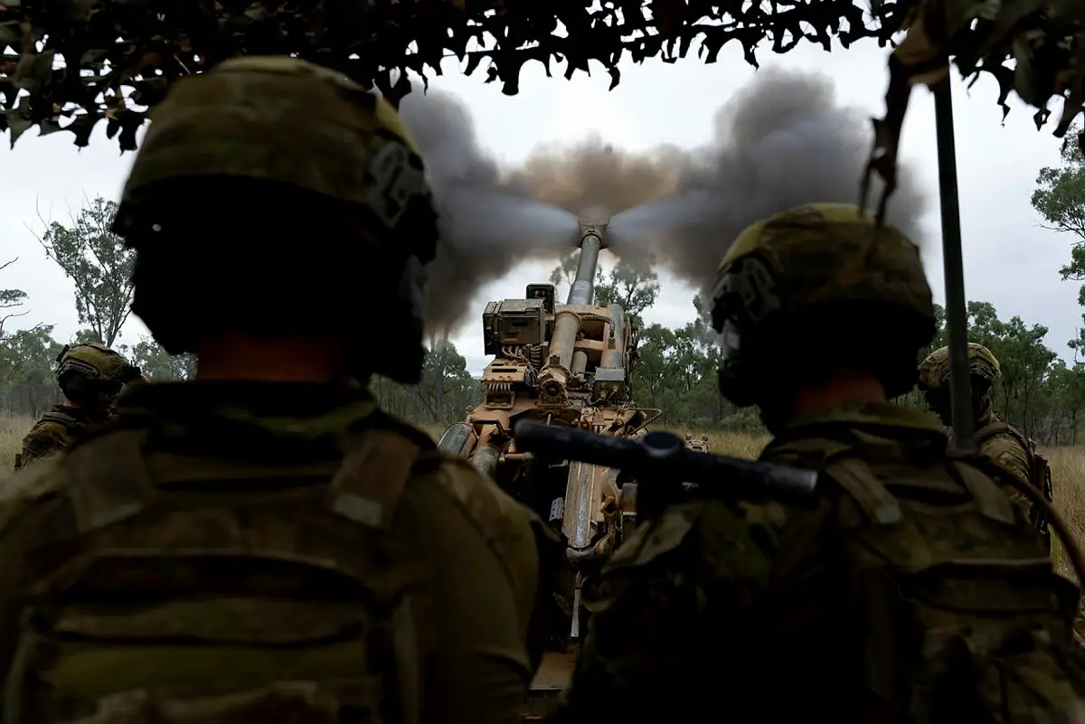Australian Army soldiers from the 4th Regiment, Royal Australian Artillery, fire an M777 Howitzer during a fire mission on Exercise Chau Pha at Townsville Field Training Area on 22 May 2021.
