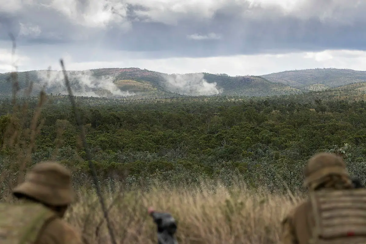 Australian Army soldiers from the 4th Regiment, Royal Australian Artillery, observe the target during Exercise Chau Pha at Townsville Field Training Area on 22 May 2021.