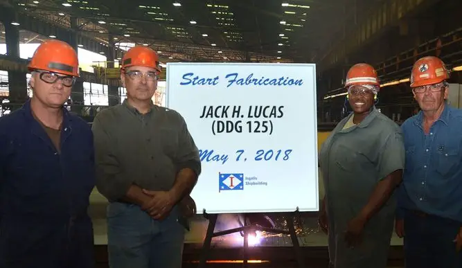 Shipbuilders in Ingalls' Steel Fabrication Shop, from left, Paul Perry, Donald Morrison, Queena Myles and Paul Bosarge, celebrate Start of Fabrication for Jack H. Lucas (DDG 125) on May 7, 2018.