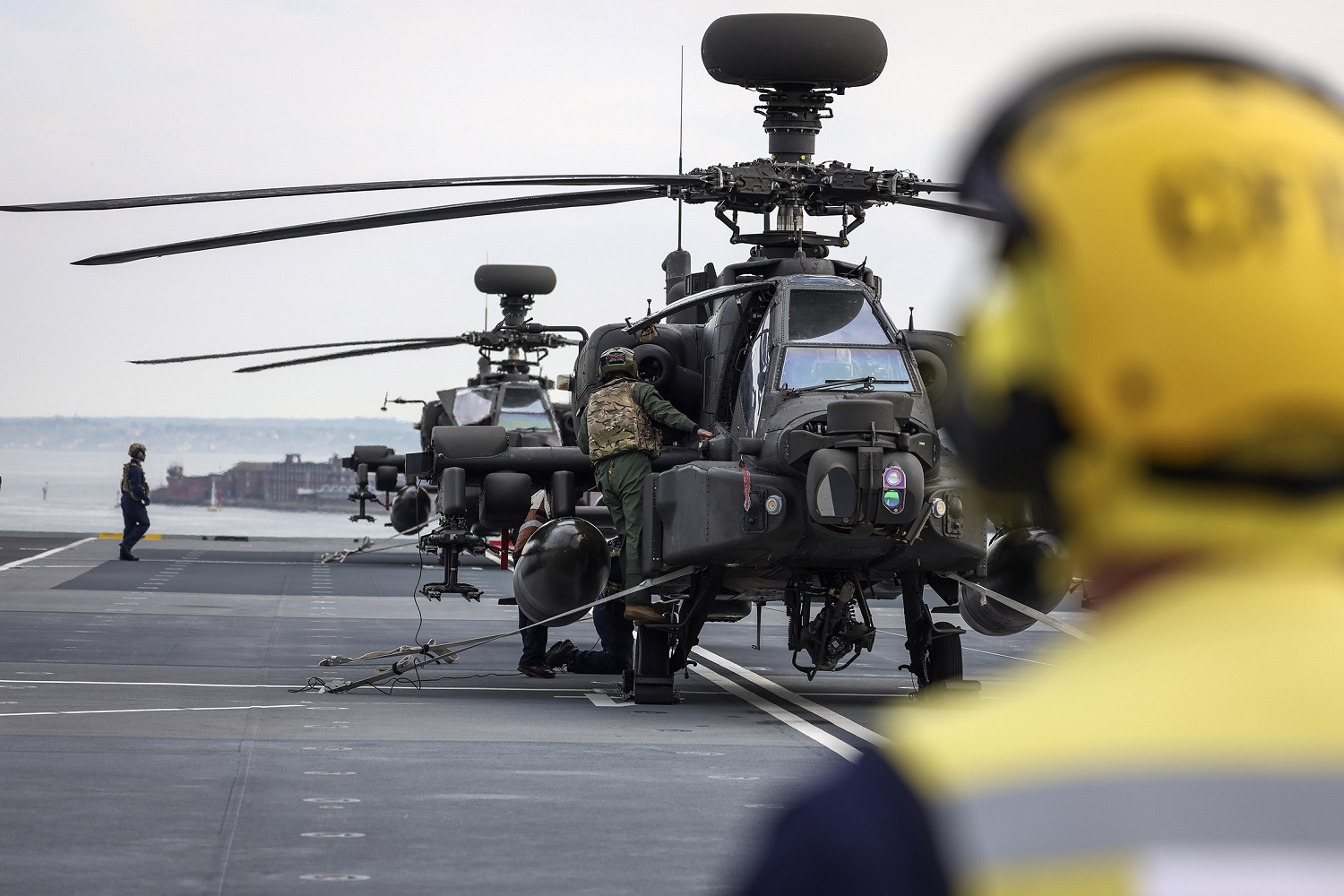 Three Apache helicopters from 656 Squadron, 4 Regiment Army Air Corps land on HMS Prince Of Wales flight deck.