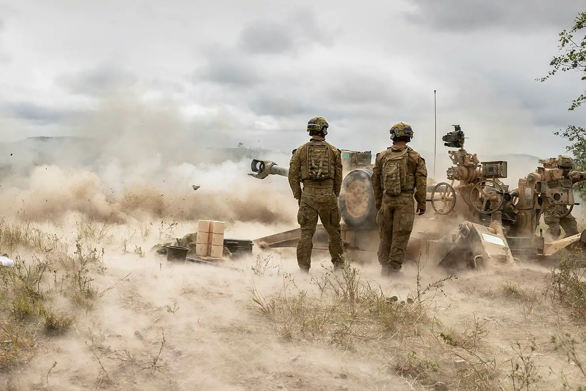 Australian Army soldiers from the 4th Regiment, Royal Australian Artillery, fire an M777 Howitzer during a fire mission on Exercise Chau Pha at Townsville Field Training Area on 22 May 2021.
