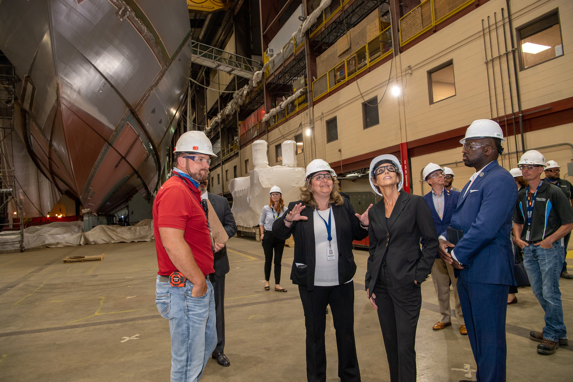Jan Allman, CEO of Fincantieri Marinette Marine (FMM) and Robyn Modly, Ship Sponsor for Littoral Combat Ship (LCS) 31, the future USS Cleveland, tour Fincantieri Marinette Marine's shipyard.