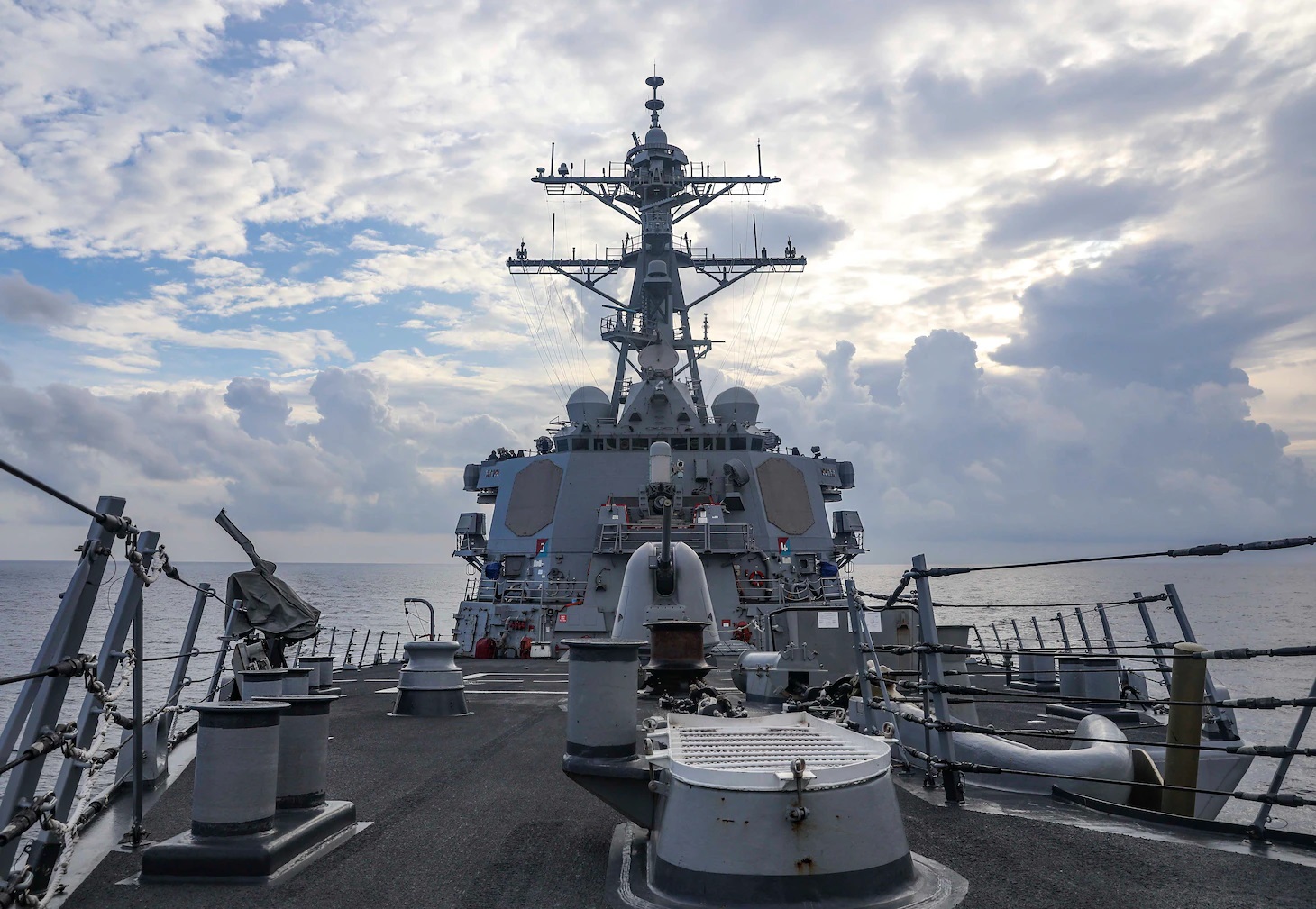 The Arleigh Burke-class guided-missile destroyer USS Benfold (DDG 65) sails through the South China Sea while conducting routine underway operations.