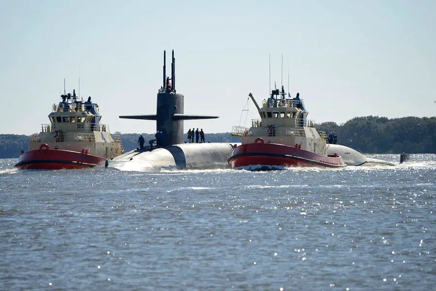 The Ohio-class ballistic-missile submarine USS Tennessee (SSBN 734) (Blue) returns to homeport at Naval Submarine Base Kings Bay, Ga., following a strategic deterrent patrol. The ship is one of six ballistic-missile submarines stationed at the base and is capable of carrying up to 20 submarine-launched ballistic-missiles with multiple warheads. (U.S. Navy photo by Mass Communication Specialist 1st Class Ashley Berumen)