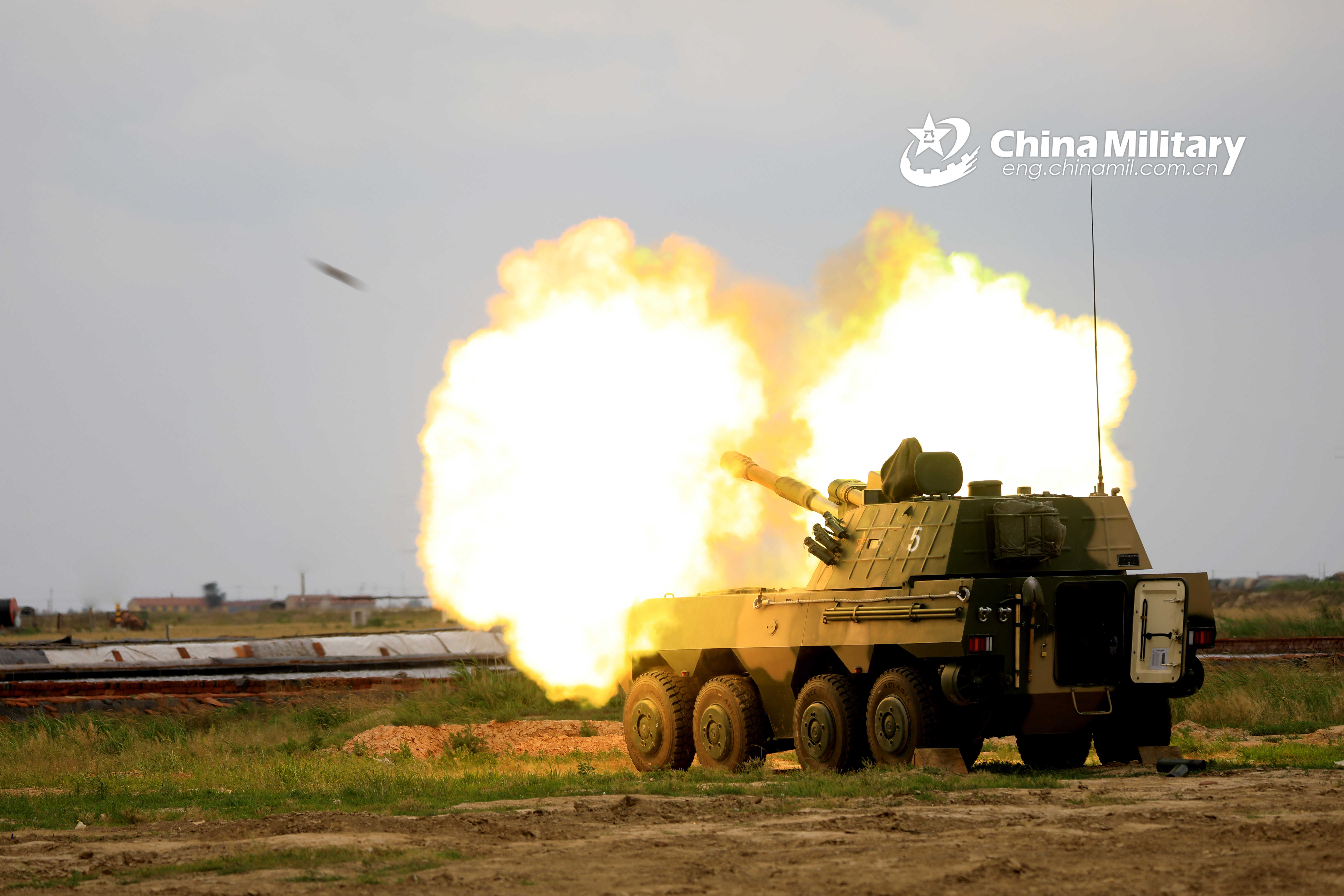 Chinese People's Liberation Army Navy Marine Corps (PLANMC) PLL-09 self-propelled howitzer conducts live firing drills. 