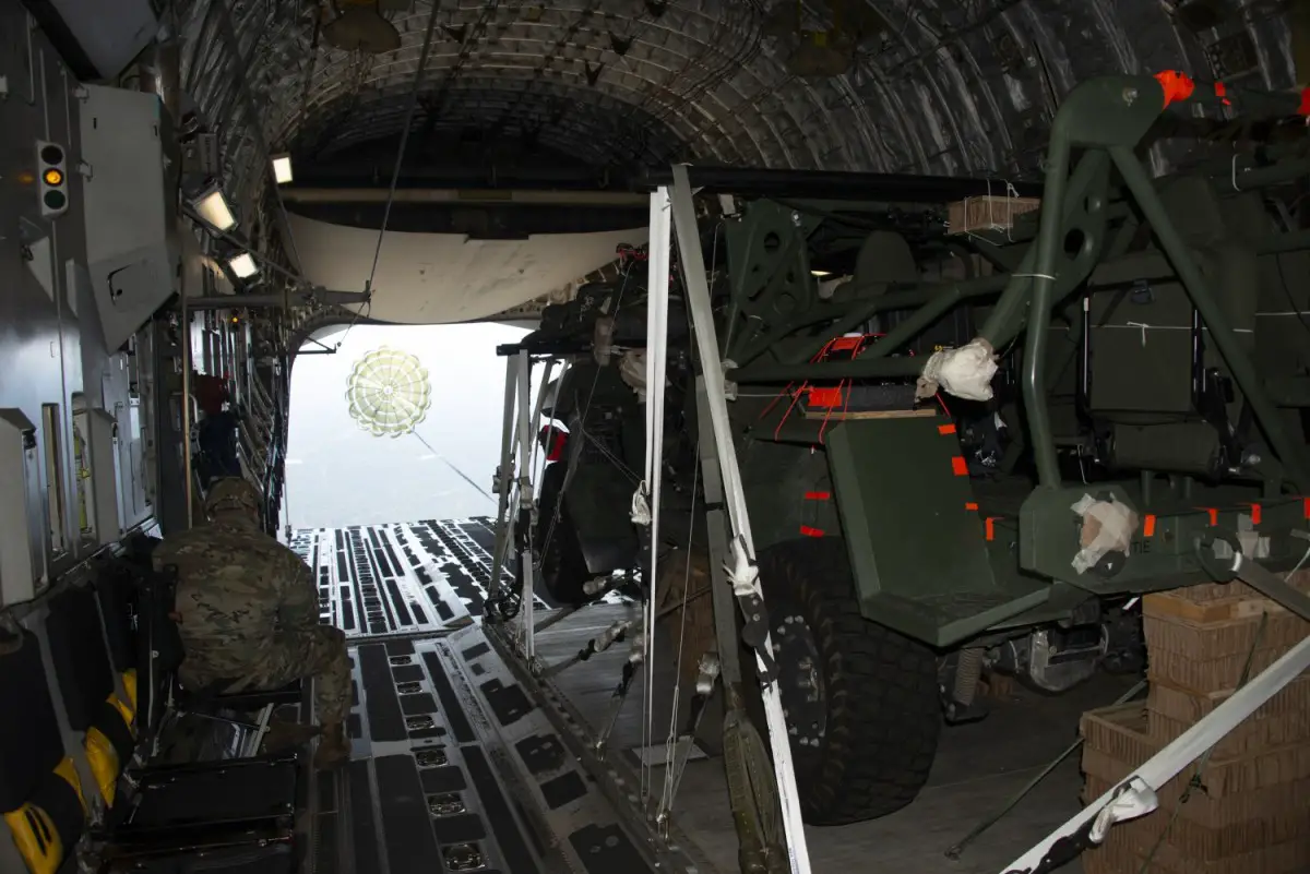 An Infantry Squad Vehicle (ISV) is extracted out of a U.S. Air Force C-17 aircraft by a 22-foot extraction parachute during a low-velocity airdrop (LVAD) during operational testing at Fort Bragg, North Carolina. 