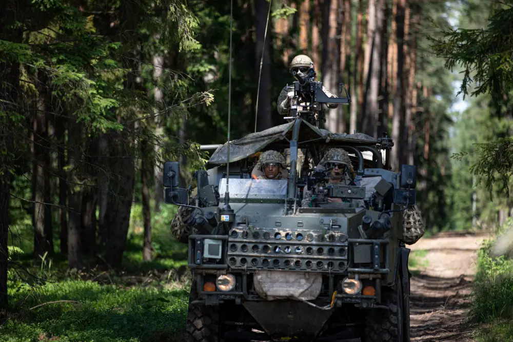 British Army soldiers operate a "Jackal" vehicle during deployment readiness exercise "Rifle Ready" at Bemowo Piskie Training Area, Poland, July 1, 2021.