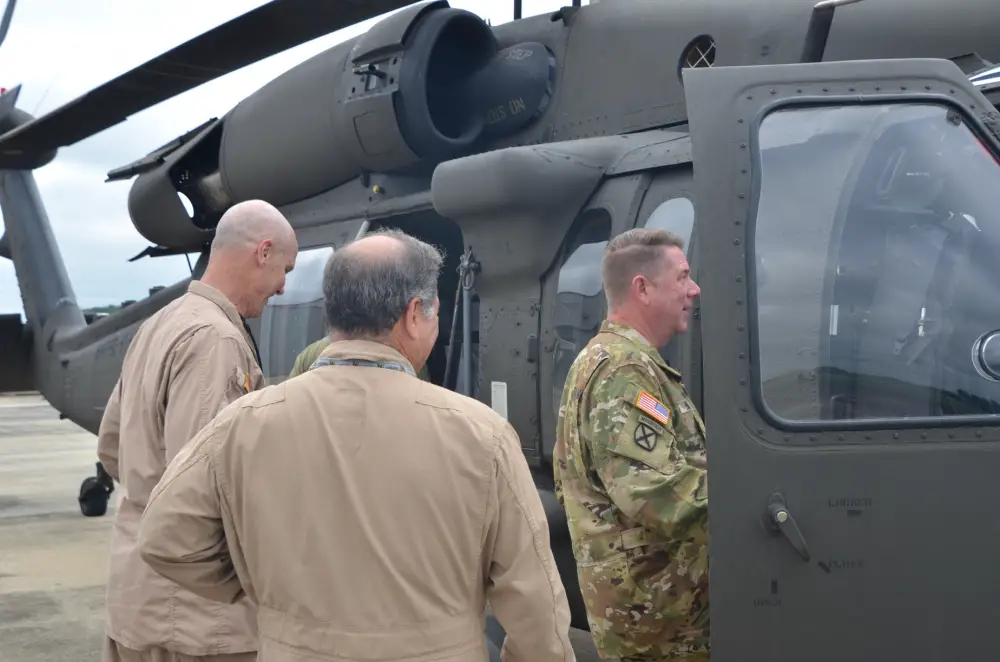Maj. Gen. Todd Hunt, right, the North Carolina Adjutant General and chairman of the Army National Guard Aviation Readiness Council, enters the cockpit of a UH-60V Black Hawk helicopter at the Huntsville, Al. International Airport July 13 for a demonstration flight of the aircraft.